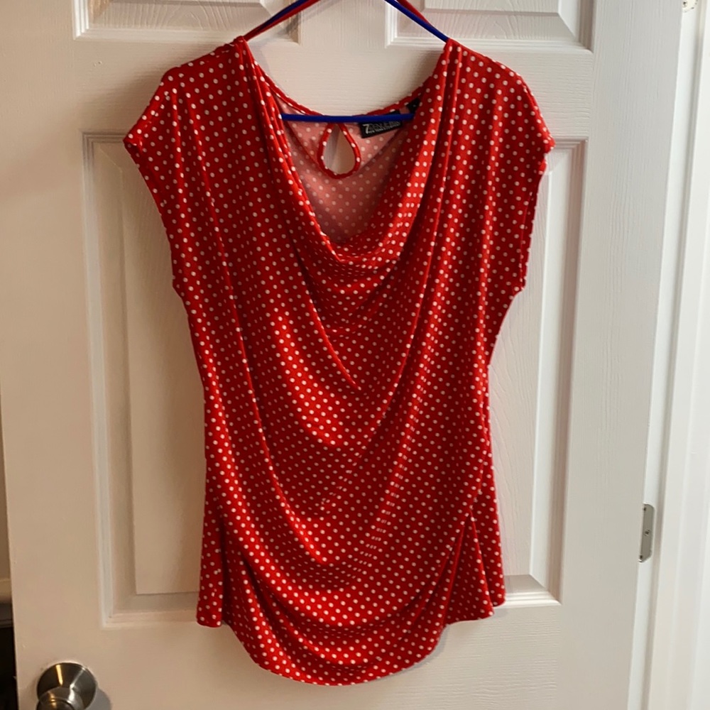 Red and white polka dots. Super cute shirt.